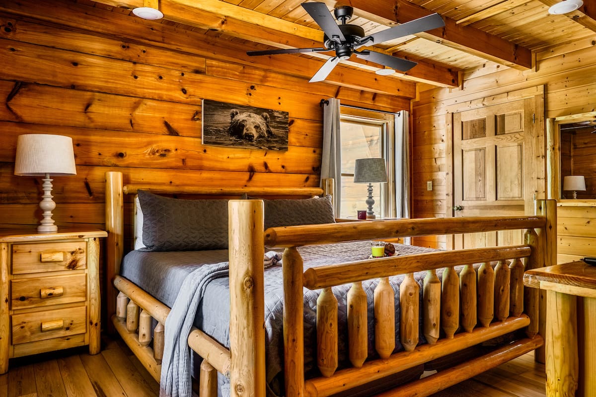 Bedroom 2 — King Bed with Bear Artwork & Ceiling Fan